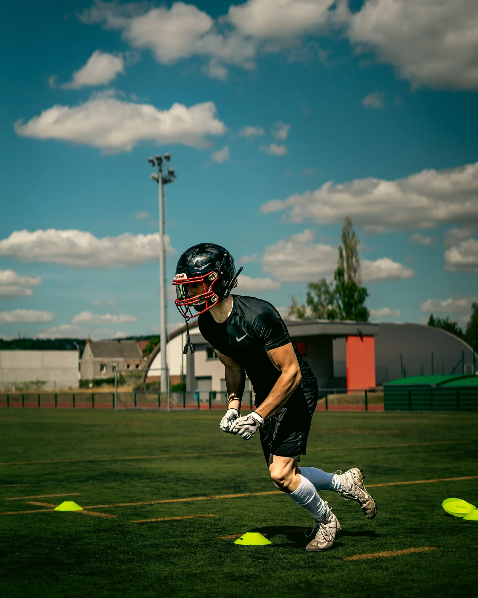 Football player completing physical performance training