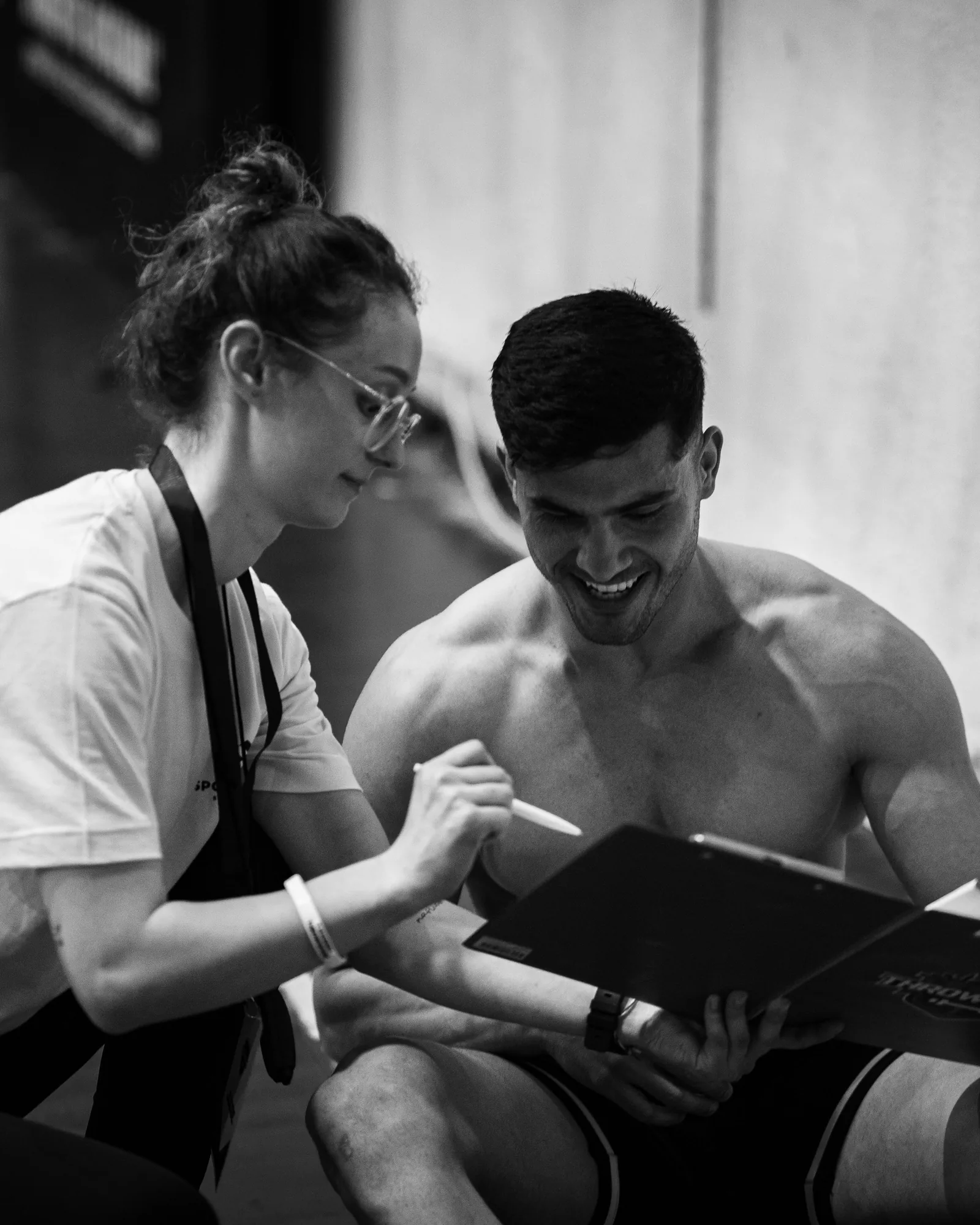 Coach reviewing athlete performance assessment